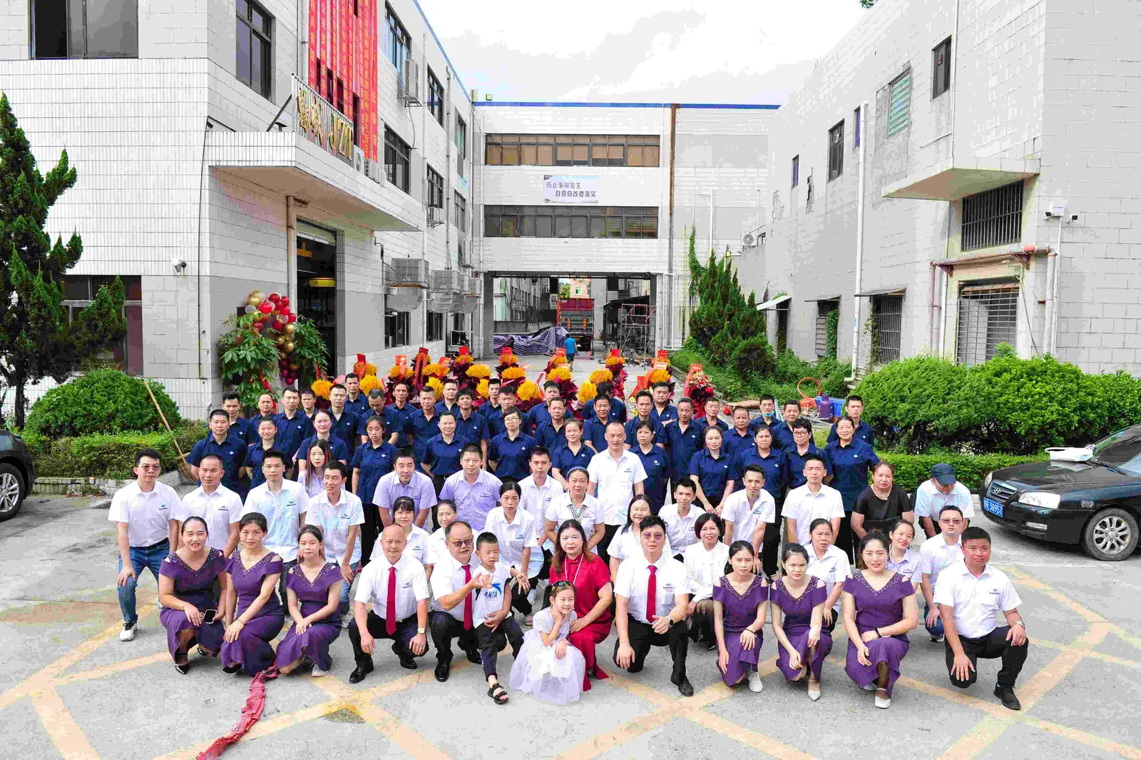 CS Molds employees gathered outside the factory