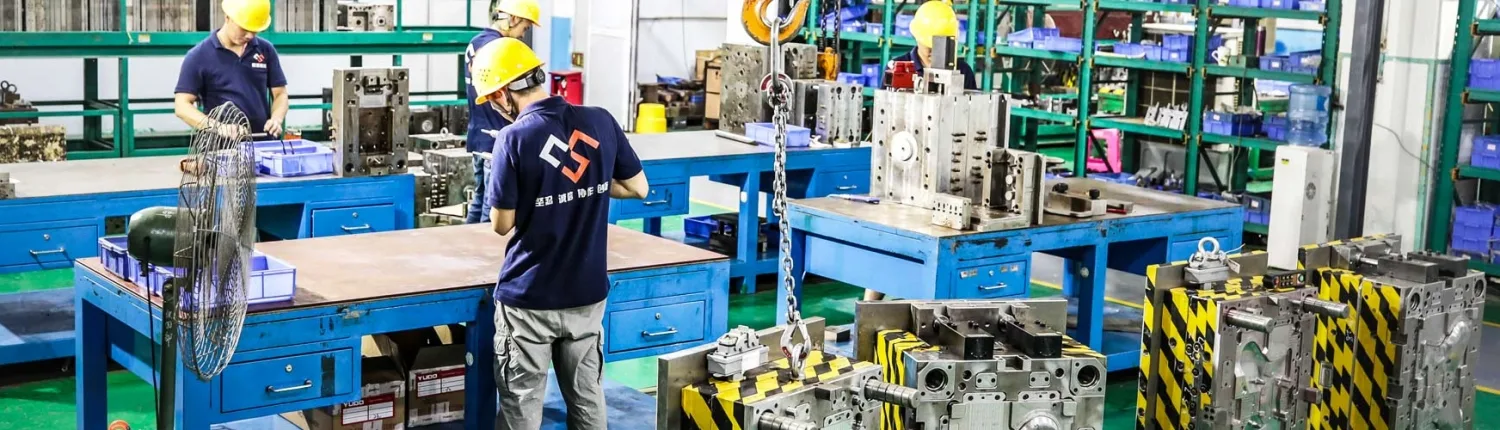 Mold assembly technicians working in the tooling workshop