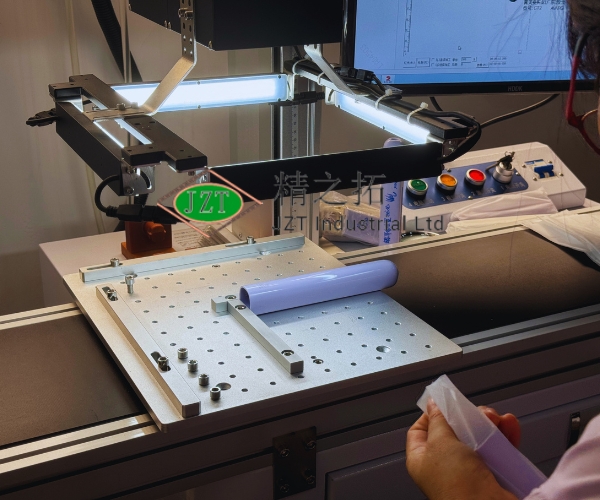 Operator inspecting precision parts on an optical measuring machine
