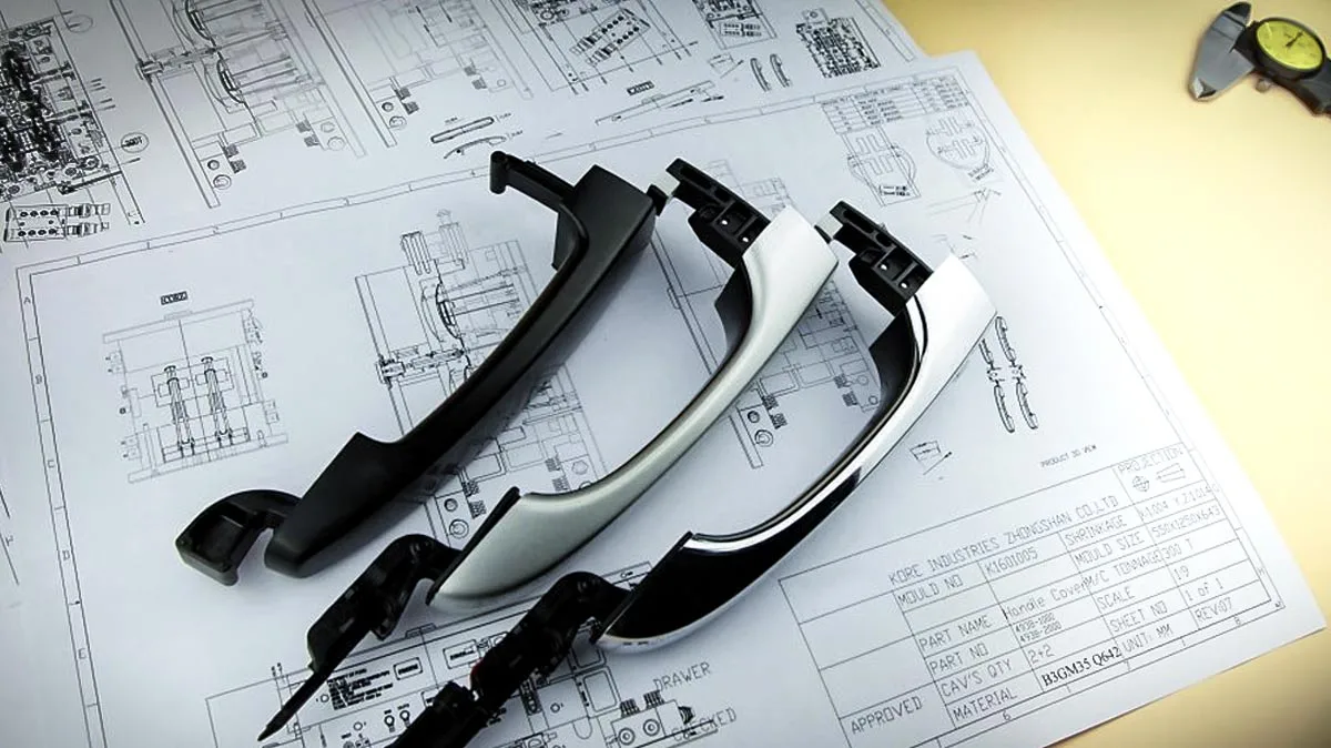 Molded plastic parts arranged on a technical drawing