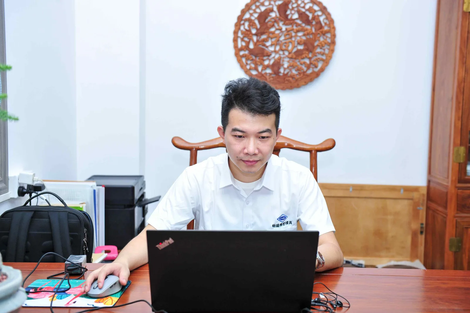 Project manager working on a laptop in the office